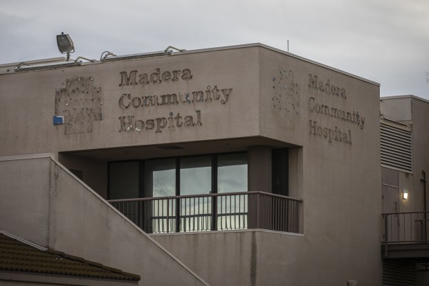 Outline of the Madera Community Hospital sign and crest on the main buildings of the hospital on Jan. 2, 2023. The sign was removed after the hospital announced its closure due to bankruptcy pushing the county into a state of emergency. Photo by Larry Valenzuela, CalMatters/CatchLight Local