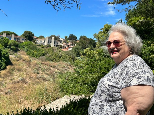Rancho Palos Verdes Mayor Barbara Ferraro looks out over the damage to townhouses on Peartree Lane in neighboring Rolling Hills Estates on July 13, 2023. The landslide, on Saturday, July 8, took out at least 10 residences. Officials have yet to pinpoint a cause for the massive land movement, but many, including Ferraro, have said they believe the event was an anomaly and are not worried about other incidences, they said. (Photo by Lisa Jacobs, Daily Breeze/SCNG)