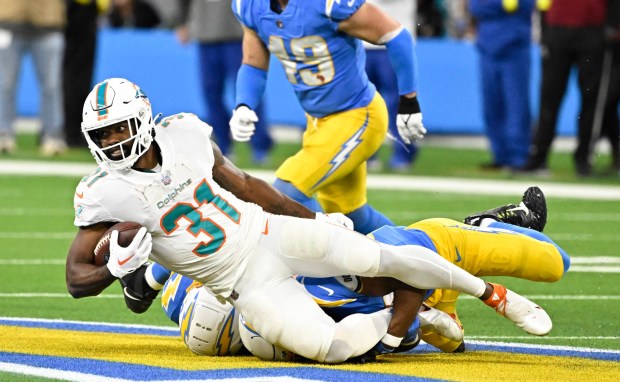 Running back Raheem Mostert #31 of the Miami Dolphins runs for first down against the Los Angeles Chargers in the first half of a NFL football game at SoFi Stadium in Inglewood on Sunday, December 11, 2022. (Photo by Keith Birmingham, Pasadena Star-News/ SCNG)