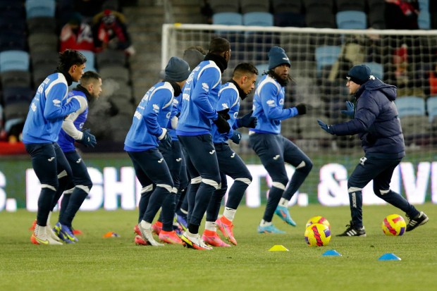 Honduras players warm up before their CONCACAF World Cup qualifying match against the United States on Wednesday night in frigid in St. Paul, Minn. (AP Photo/Andy Clayton-King)