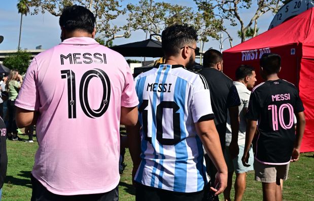 Fans wear Lionel Messi jerseys ahead of the MLS match between Inter Miami CF and Los Angeles FC on Sunday at BMO Stadium. (Photo by Frederic J. Brown/AFP via Getty Images)